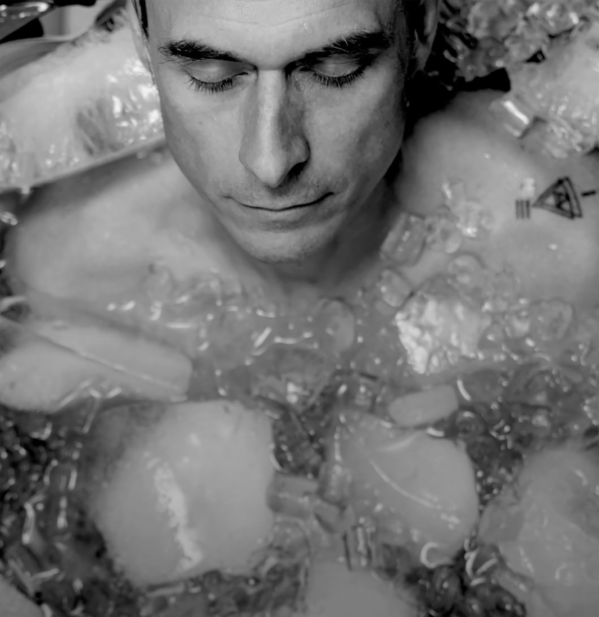 Matt chest deep in an ice bath, eyes closed